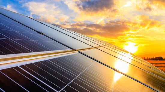 Photovoltaic solar panels on sunset sky background,green clean e